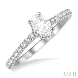 1/2 Ctw Round Cut Diamond Engagement Ring With 1/4 ct Oval Cut Center Stone in 14K White Gold