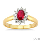 6x4MM Oval Cut Ruby and 1/5 Ctw Round Cut Diamond Ring in 14K Yellow Gold