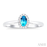 5x3 MM Oval Shape Blue Topaz and 1/20 Ctw Single Cut Diamond Halo Semi-Precious Ring in 14K White Gold