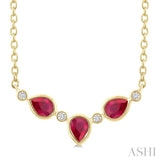 4X3MM Pear Cut Ruby and 1/50 Ctw Bezel Set Round Cut Diamond Precious Fashion Necklace in 10K Yellow Gold