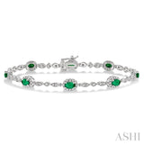 5x3 MM Oval Cut Emerald and 1/20 Ctw Round Cut Diamond Bracelet in 10K White Gold