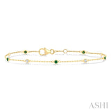 1.8 MM Emerald and 1/10 Ctw Bezel Set Round Cut Diamond Precious Gemstone Station Bracelet in 14K Yellow Gold